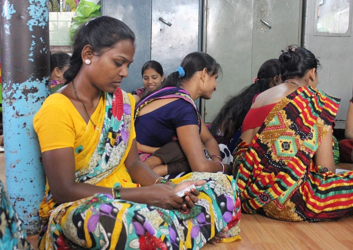 A group of women in India test the DOST Education app that equips parents to engage in their children's learning.