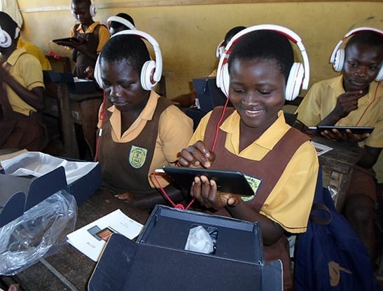 Children use tablets provided by the ACR GCD-funded project by Open Learning Exchange in Ghana.