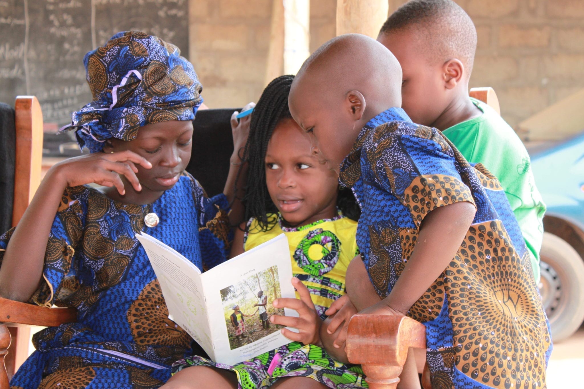 Children in Benin read local language books created by Michigan State University students using Bloom software.