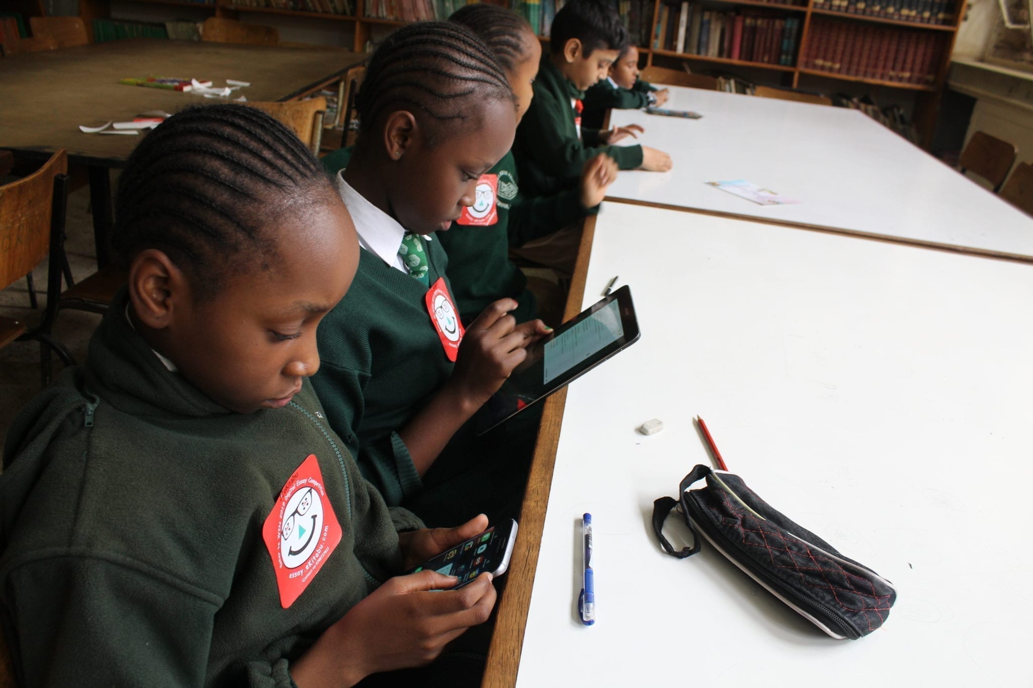 Children in Kenya interact with accessible digital books created by eKitabu.