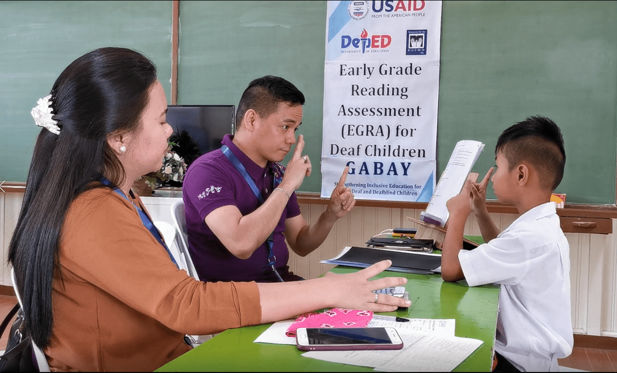 A child who is deaf takes the adapted Early Grade Reading Assessment through the Gabay project implemented by Resources for the Blind and funded by USAID in the Philippines.